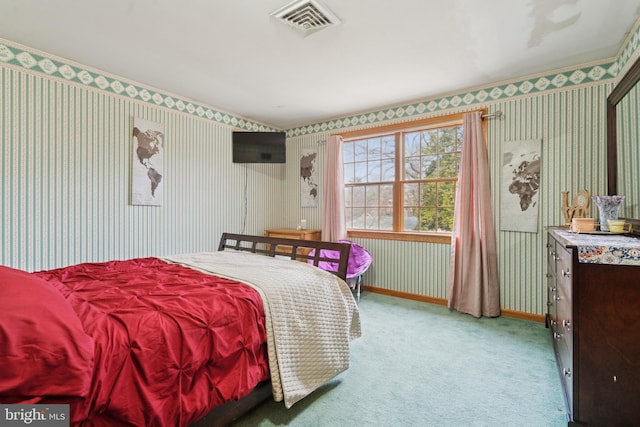 carpeted bedroom with visible vents, baseboards, and wallpapered walls