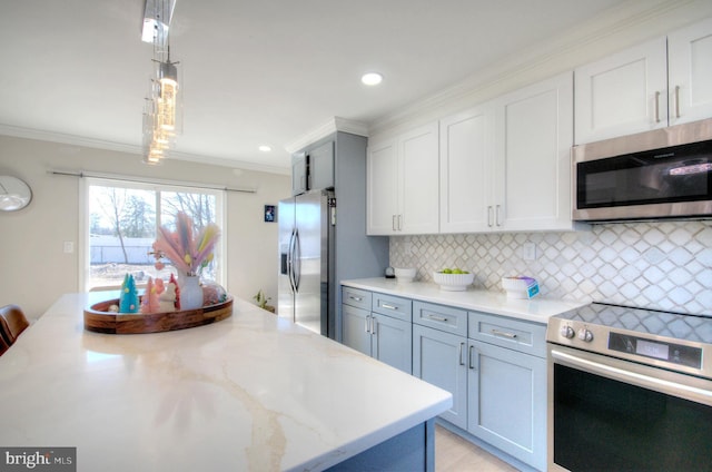 kitchen featuring crown molding, stainless steel appliances, tasteful backsplash, white cabinetry, and light stone countertops