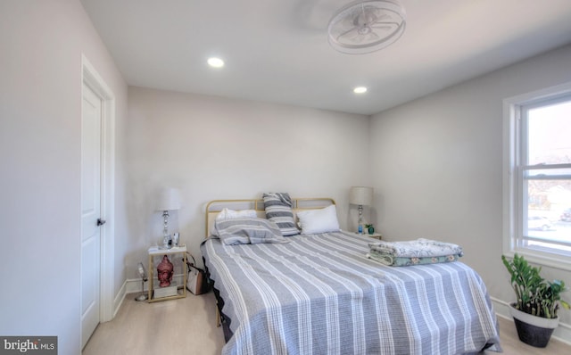 bedroom featuring recessed lighting, baseboards, and wood finished floors