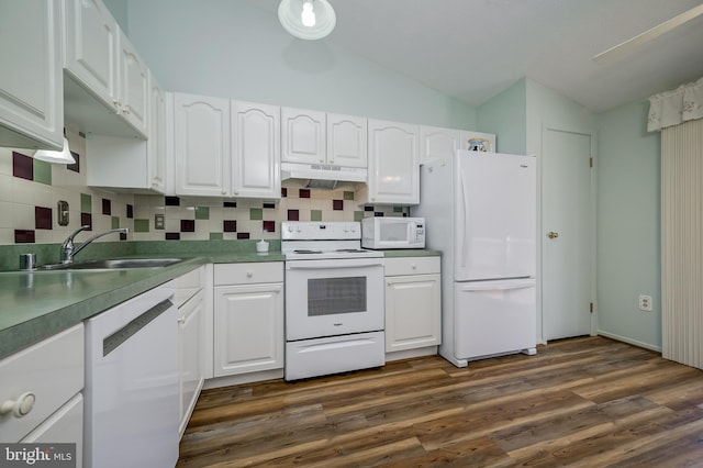 kitchen featuring white appliances, vaulted ceiling, under cabinet range hood, and white cabinets