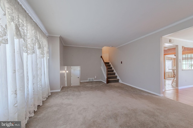 unfurnished living room featuring visible vents, stairs, baseboards, and carpet floors