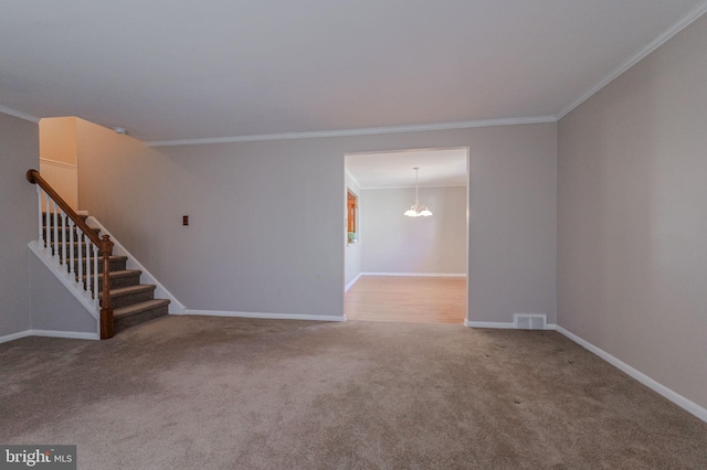 spare room with carpet, baseboards, visible vents, ornamental molding, and stairs