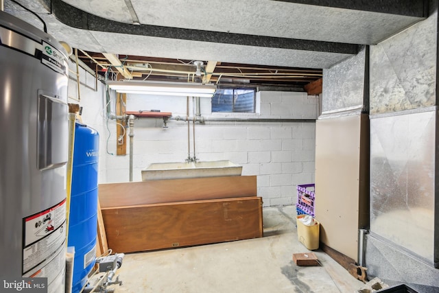 unfinished basement featuring water heater