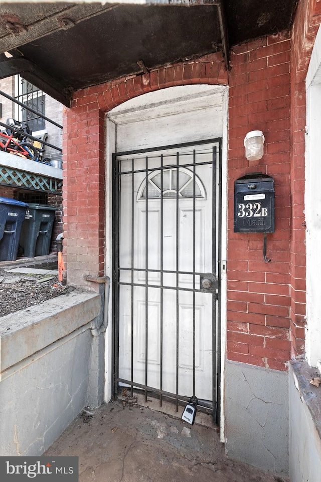 entrance to property with brick siding