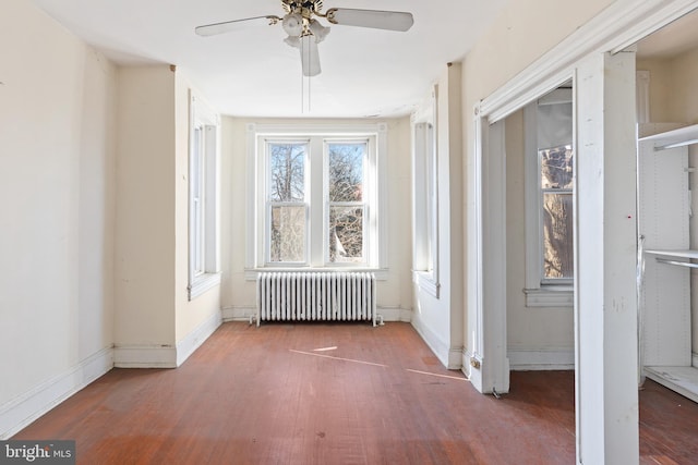 interior space featuring a ceiling fan and radiator