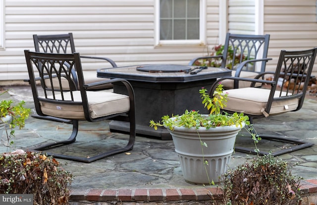 view of patio / terrace featuring an outdoor fire pit