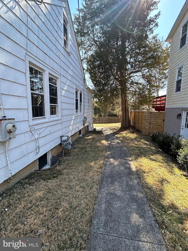 view of home's exterior with fence