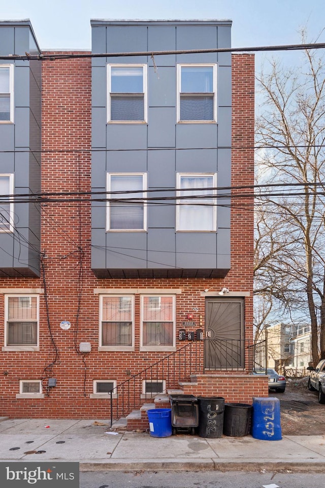 view of front of property featuring brick siding