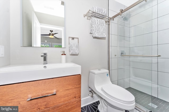 full bath with vanity, visible vents, a stall shower, ceiling fan, and toilet