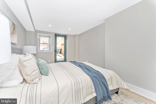 bedroom featuring recessed lighting, baseboards, and wood finished floors