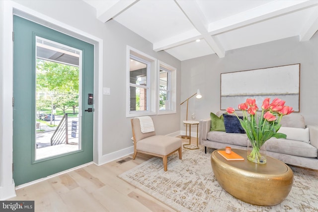 sitting room featuring beam ceiling, wood finished floors, baseboards, and visible vents