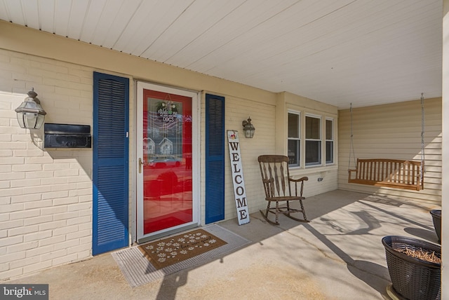 property entrance with a porch