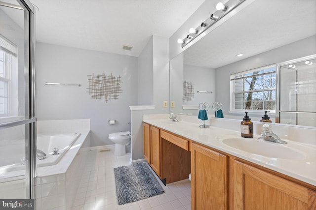 full bath with toilet, a garden tub, a sink, and tile patterned floors