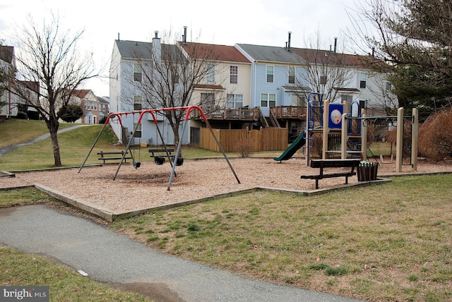 community play area with a lawn