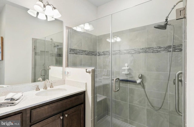 bathroom with vanity and a shower stall