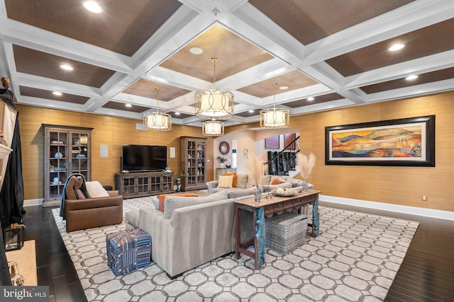 living room featuring recessed lighting, beamed ceiling, baseboards, and stairs