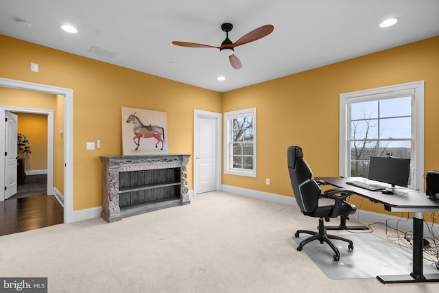 carpeted office with a ceiling fan, recessed lighting, a fireplace, and baseboards