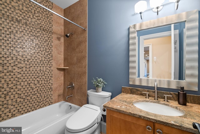 bathroom featuring toilet, shower / bath combination, and vanity