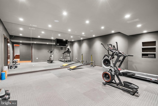 workout area featuring baseboards and recessed lighting