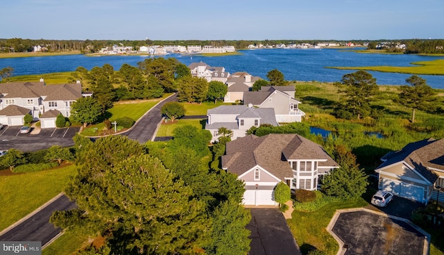 birds eye view of property featuring a water view and a residential view