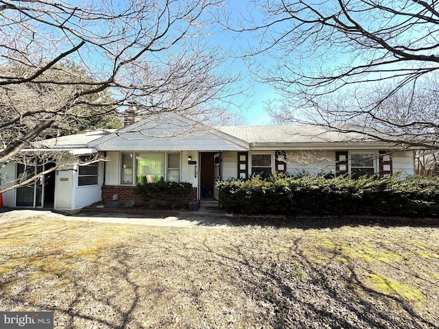 view of front of house with brick siding