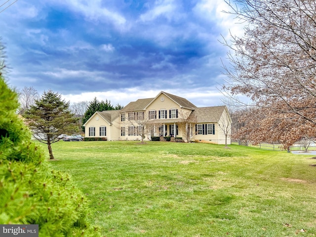 view of front of house featuring a front yard, crawl space, and fence