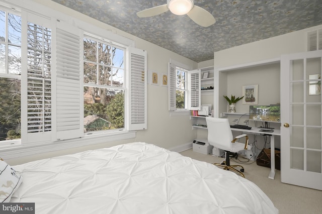 bedroom with light carpet, baseboards, and visible vents