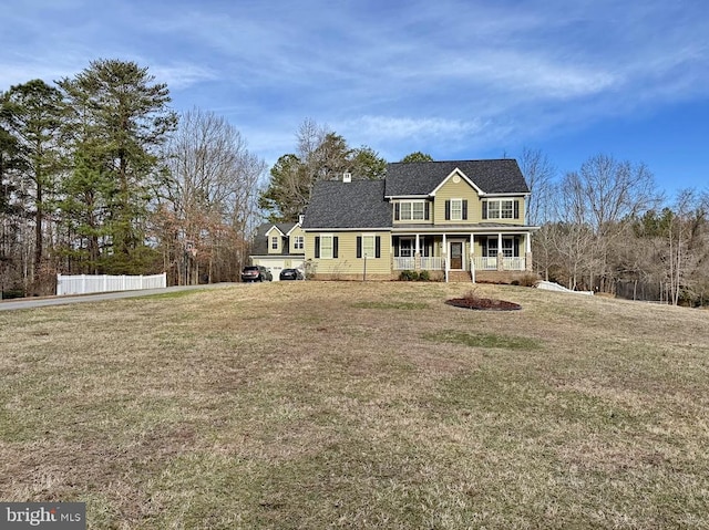 view of front of house with a porch and a front lawn