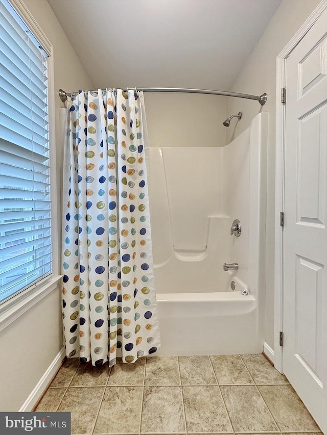 full bathroom featuring tile patterned flooring and baseboards