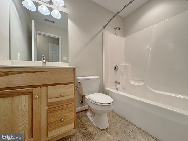 bathroom featuring tile patterned floors, visible vents, toilet, bathtub / shower combination, and vanity