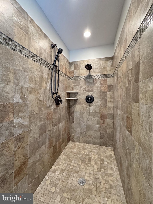 full bathroom with tiled shower