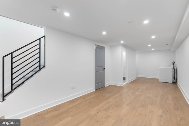 interior space with light wood-type flooring, stairway, baseboards, and recessed lighting