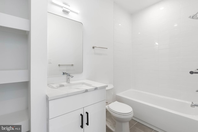 full bathroom featuring  shower combination, vanity, toilet, and tile patterned floors