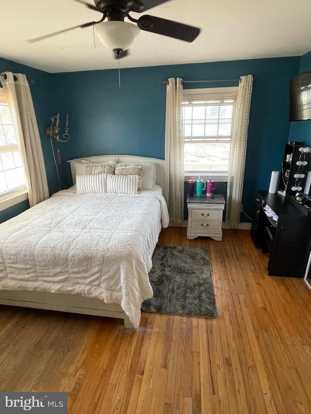 bedroom featuring light wood-style floors and ceiling fan