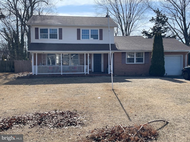 traditional-style home featuring brick siding, dirt driveway, a porch, an attached garage, and fence