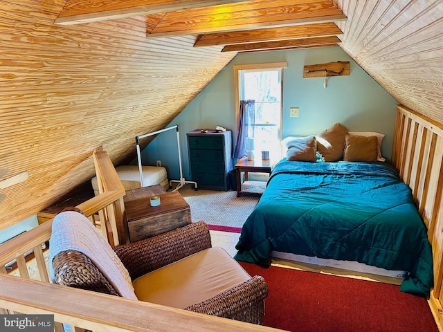 carpeted bedroom with lofted ceiling with beams