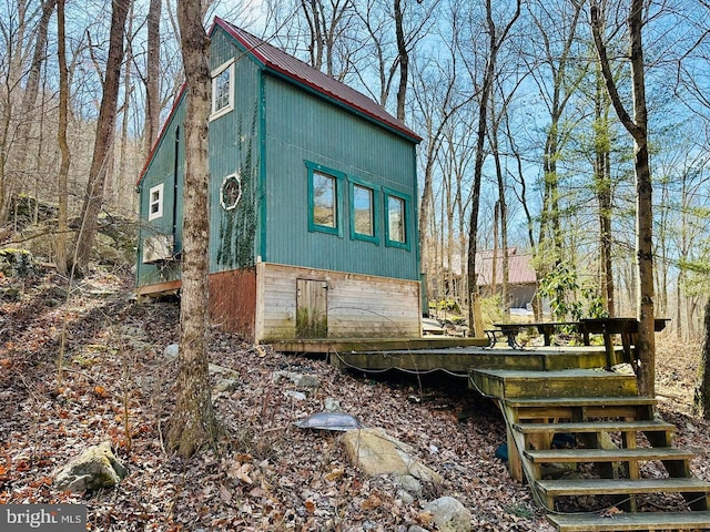 view of property exterior with metal roof