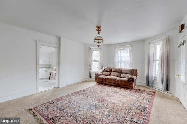 living area with carpet floors and baseboards