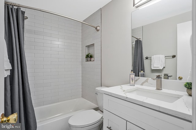 bathroom with toilet, shower / tub combo with curtain, and vanity