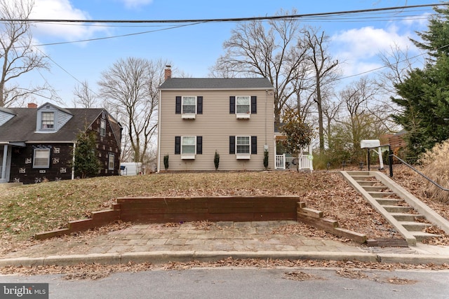 view of front of property featuring a chimney