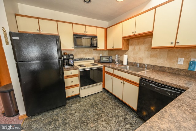 kitchen featuring black appliances, cream cabinetry, backsplash, and a sink