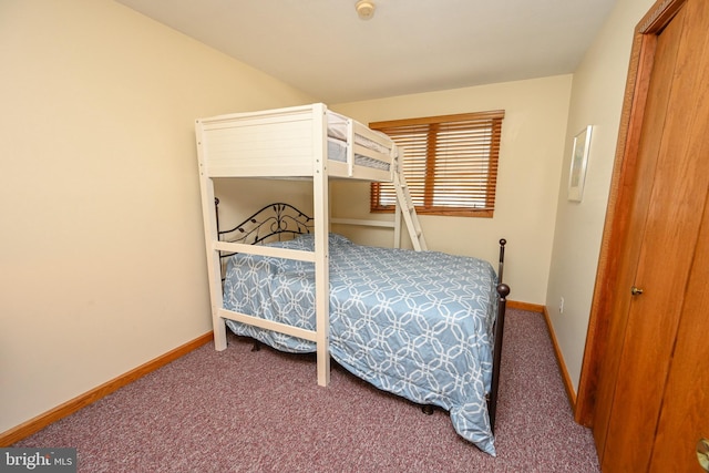 bedroom featuring carpet flooring and baseboards