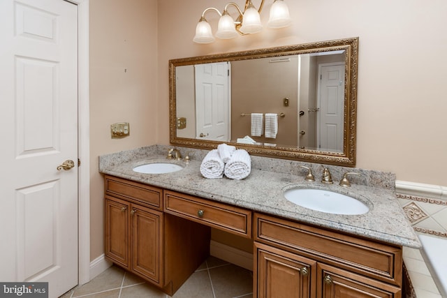 full bath featuring a sink, double vanity, and tile patterned flooring