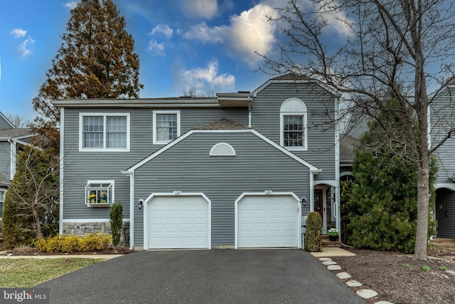 view of front facade featuring a garage and driveway