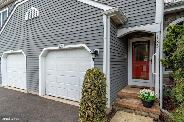 entrance to property with a garage