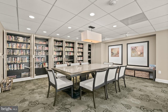 dining area with built in shelves, recessed lighting, carpet flooring, and baseboards