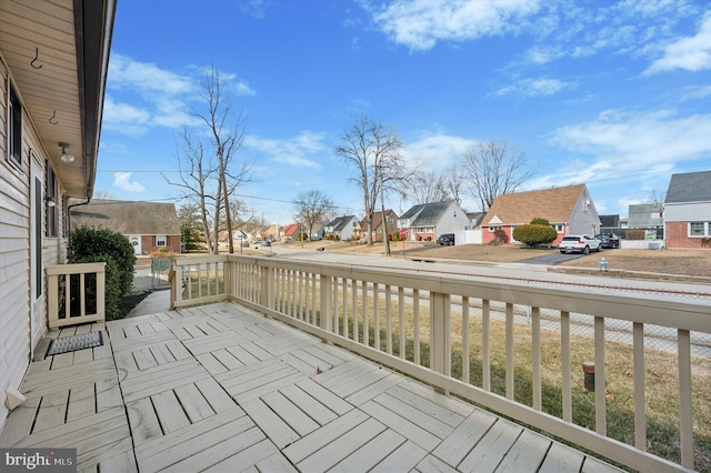 wooden terrace with a residential view