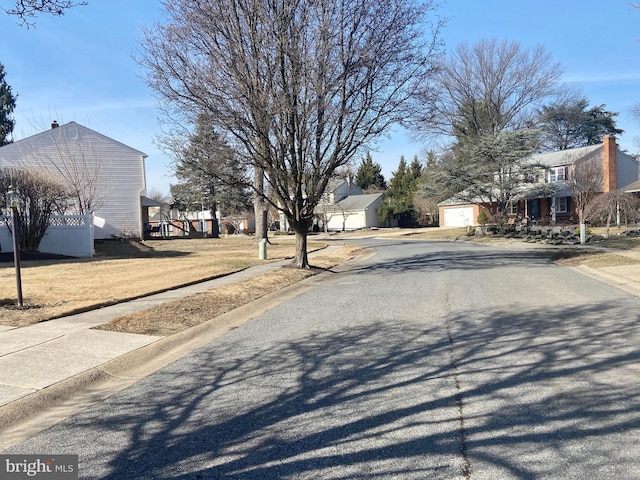 view of street featuring curbs and sidewalks