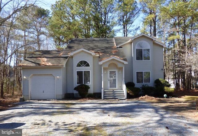 view of front facade with driveway and an attached garage