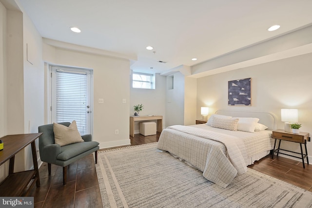 bedroom with baseboards, wood finished floors, and recessed lighting